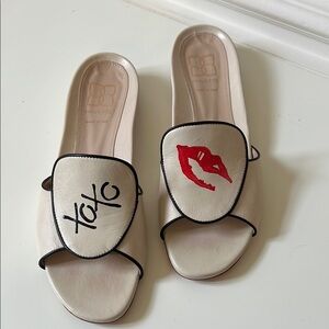 Mavette Capri Ivory Calfskin Slides with “Hugs and Kisses”.